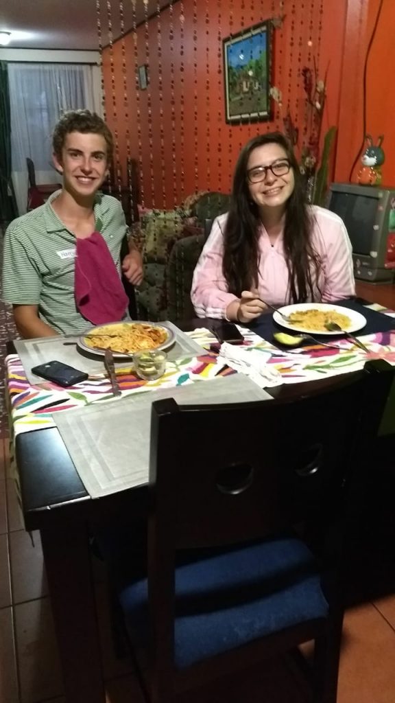 Spanish immersion participant having dinner with host family!