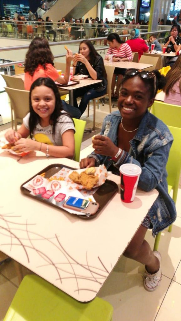 Spanish immersion participant having dinner with host family!