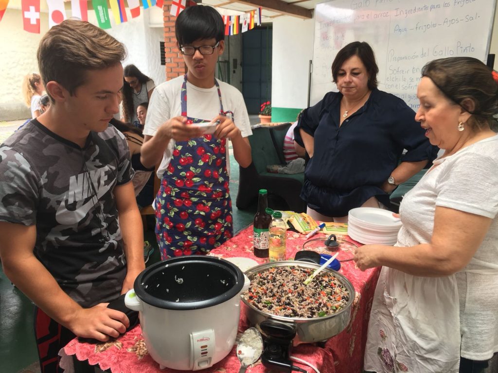 High school Spanish immersion participants cook Gallo Pinto