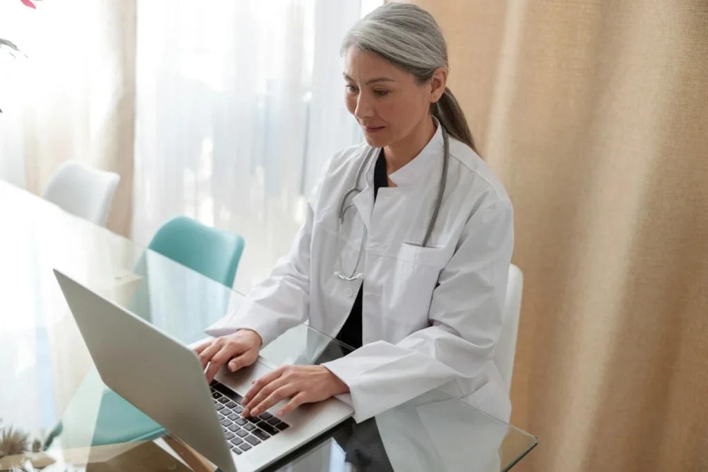 medical-specialist-working-on-laptop-at-office